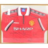 An Umbro multi-signed Manchester United football shirt, with the Sharp sponsor, 72 x 60cm,