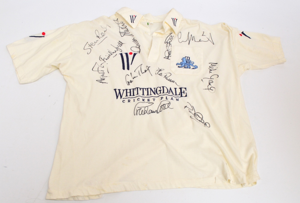 An England cricket shirt by AMS, multi-signed, by Graham Thorpe, Devon Malcolm, Mike Gatting,