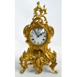 A 1950s decorative gilt meal mantel clock,