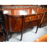 A reproduction sideboard with central drawer and two bow front cupboard doors to either side on