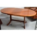 A retro Parker Knoll teak extending dining table, width when extended 175cm.