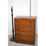 An oak five drawer chest of drawers, width 76cm and a wooden standard lamp on circular base (2).