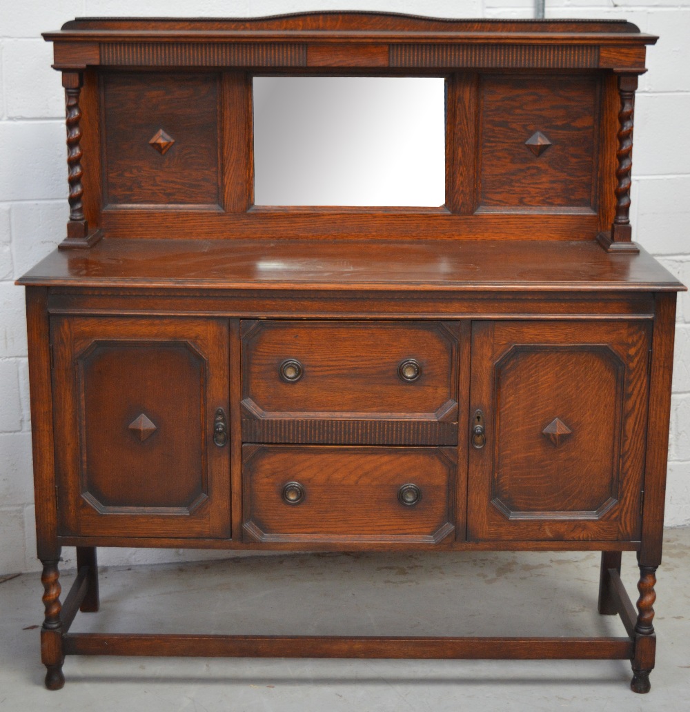 An oak mirror back sideboard with barleytwist supports,