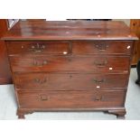 A 19th century mahogany two-over-three chest of drawers with brass handles and escutcheons on