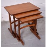 A retro nest of three G-Plan teak tables, width of largest 56cm.