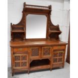 A late 19th century Arts and Crafts oak mirror back sideboard,