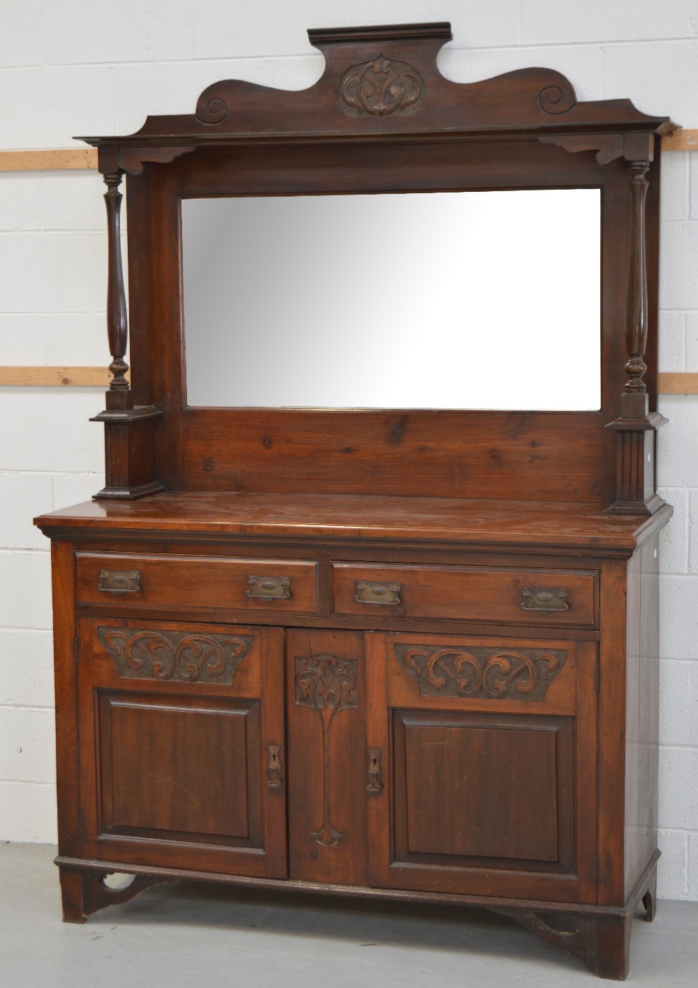 An early 20th century walnut mirror back sideboard, width 135cm.