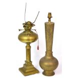 Two brass table lamps, one formerly an oil lamp, presented on stepped square section base,