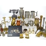 A quantity of metalware to include brass candelabrum, figures of horses, candlesticks etc.