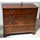 A 19th century mahogany two-over-three chest of drawers with brass handles and escutcheons on