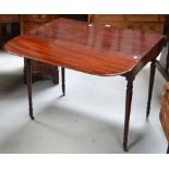 A mahogany Pembroke table on tapering ring turned legs and castors, width approx 106cm.