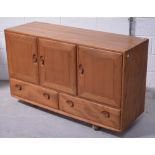 A retro Ercol style sideboard on castors, width 129cm.