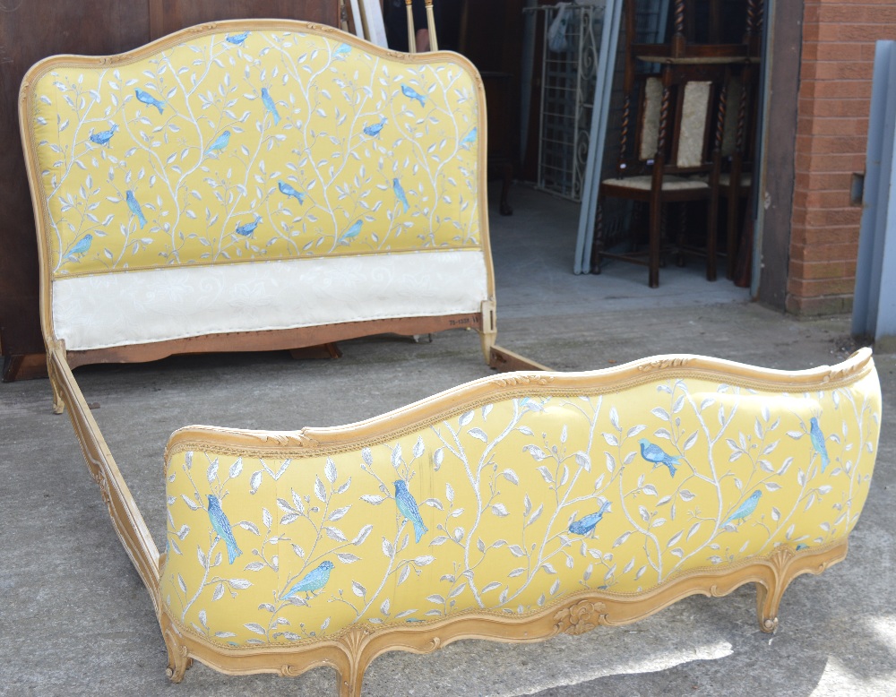 A French double bed upholstered in Sandersons 'Finches' pattern fabric,