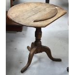 An oak occasional table with circular top above tripod support, width 67cm (af).
