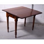 A mahogany Pembroke table with single drawer on turned legs, width when extended 95cm.