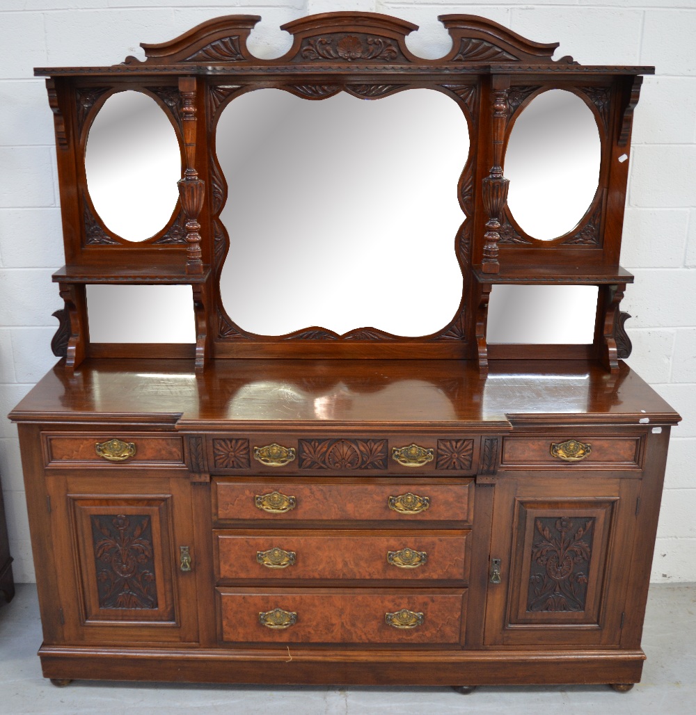 An early 20th century triple mirror back mahogany break front sideboard,