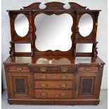 An early 20th century triple mirror back mahogany break front sideboard,