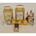 A collection of clocks including a Taylor and Bligh brass carriage clock,