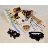 A small quantity of costume jewellery comprising predominantly bead necklaces,