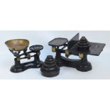 A set of cast iron Victor scales with a brass pan, a further larger set of scales,