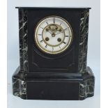 A late 19th century French black slate and green marble set mantel clock with white enamel dial set