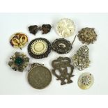 A small quantity of jewellery including a Scottish silver pierced pendant,