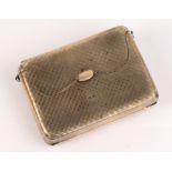 A George V hallmarked silver purse of rectangular form with engine turned decoration,