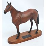 A Beswick figure of Red Rum on an oval wooden stand with plaque stating "Red Rum Winner of The