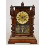An early 20th century American oak cased eight day mantel clock,