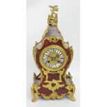 A late 19th century French faux tortoiseshell and gilt metal mounted eight day mantel clock with