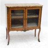 An early 20th century French kingwood display cabinet with composite marble top with canted corners,