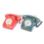 Two vintage resin telephones with spin dials, in red and green (2).