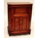 A 20th century Chinese hardwood cocktail cabinet with rising upper section and two central cupboard