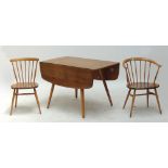 An Ercol dropleaf dining table, 112 x 123cm when extended, two elbow chairs and a further chair (4).