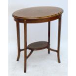 An early 20th century quarter veneered mahogany oval occasional table with string inlay to the top,