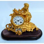A late 19th century French gilt metal figural mantel clock with drum type eight day Japy movement