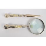 A white metal and mother of pearl handled magnifying glass, length 26cm,