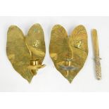 A pair of Arts and Crafts brass wall sconces modelled as water lily pads and flowers,