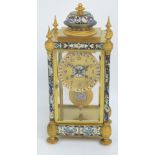A late 19th century French gilt metal and champlevé enamel decorated four glass mantel clock,
