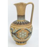 A Doulton Lambeth Silicon "Mosaic Ware" ewer with high angled handle, crimped neck and ovoid body,