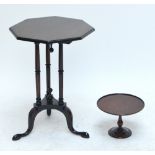 An early 20th century mahogany octagonal topped occasional table raised on tripartite base and