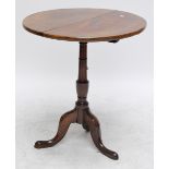 A 19th century mahogany circular tilt top table on ring turned column and tripod base,