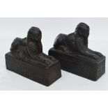 A pair of heavy resin sphinx ornaments, possibly for use as bookends, length 17cm, height 15cm.