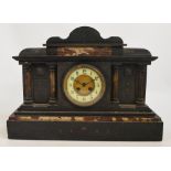 A large Victorian slate and pink marble detailed eight day mantel clock,
