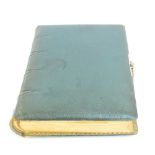 A late 19th century leather bound and gilt edged photograph album with apertures of different