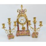 A late 19th century French marble and gilt metal mounted three piece clock garniture,