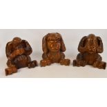 Three large 20th century wooden carved monkeys depicting hear no evil,