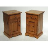A pair of modern pine bedside tables with single drawer above door enclosing two shelves,