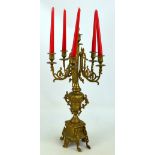 A brass five branch candelabra with removable finial to accommodate a sixth candle,