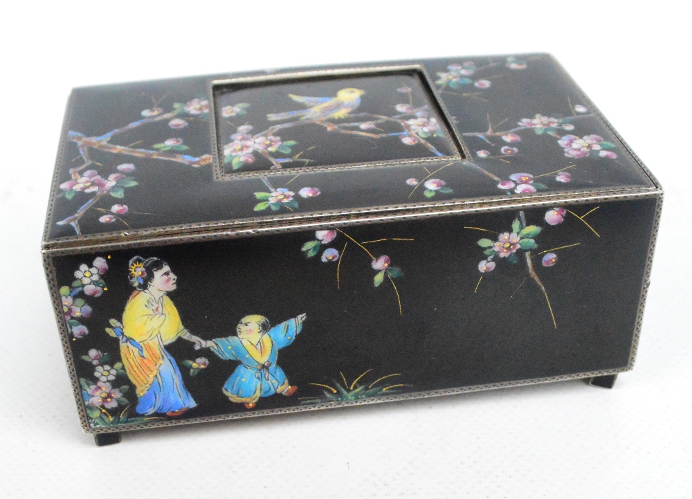 A late 19th century leather cased silver and enamel decorated singing musical bird box,